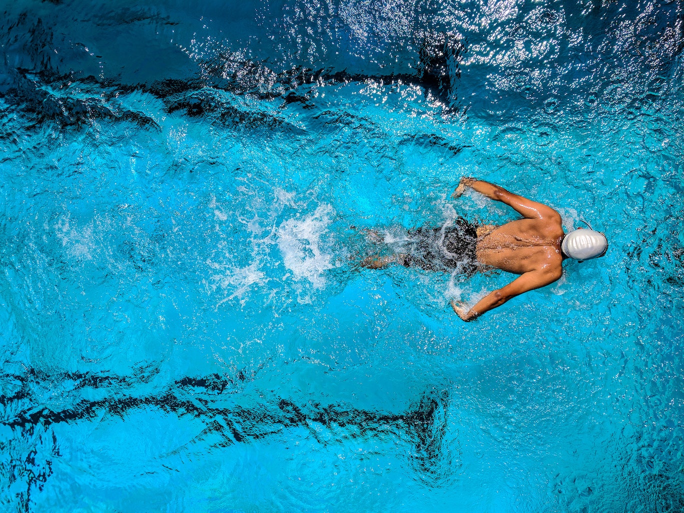 male competitive swimmer in a lane