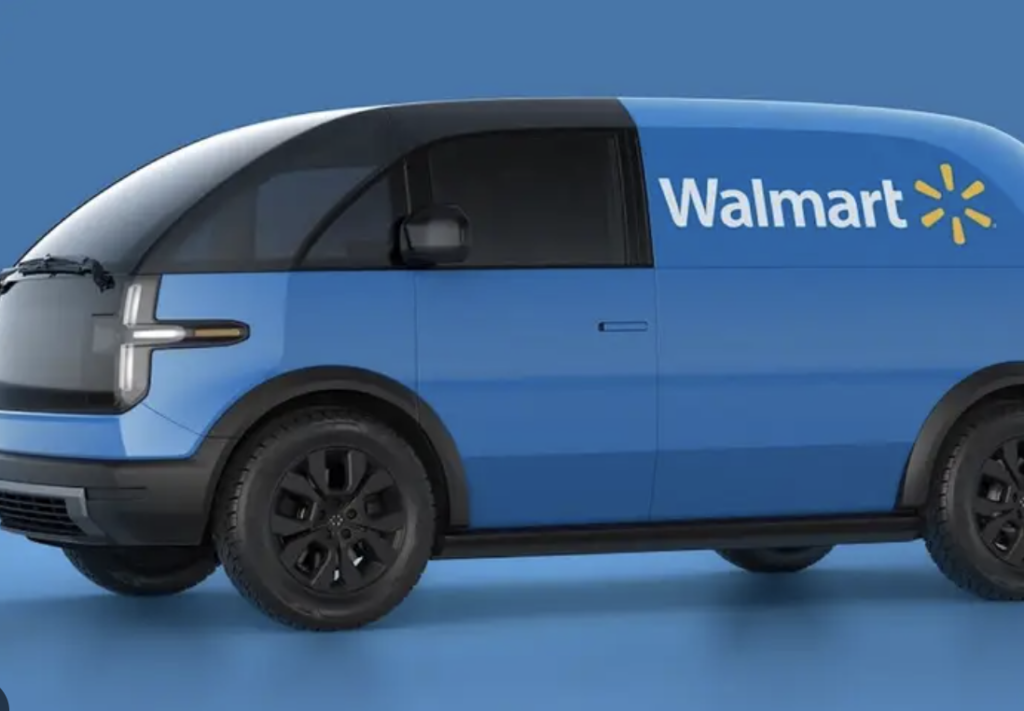 A stock image of Walmart's new electric delivery vans logo'd with Walmart brand images
