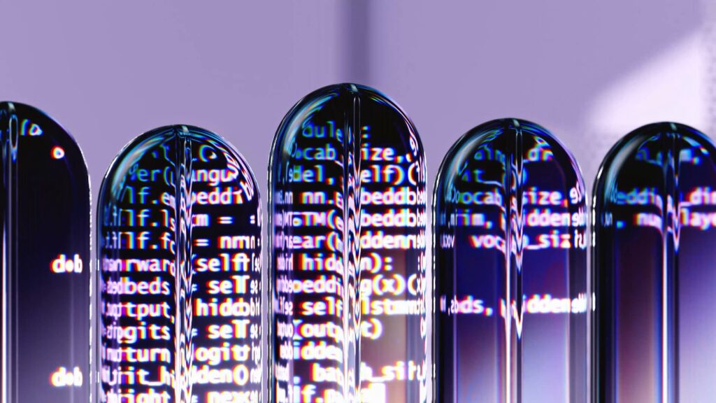 A decorative image of coded computer language seen through thin, clear, rounded acrylic pillars 