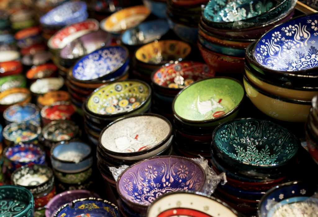 A table full of colorful handmade bowls 