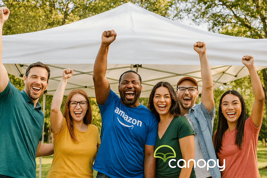 a group of amazon sellers celebrating together outdoors at an event with arms raised